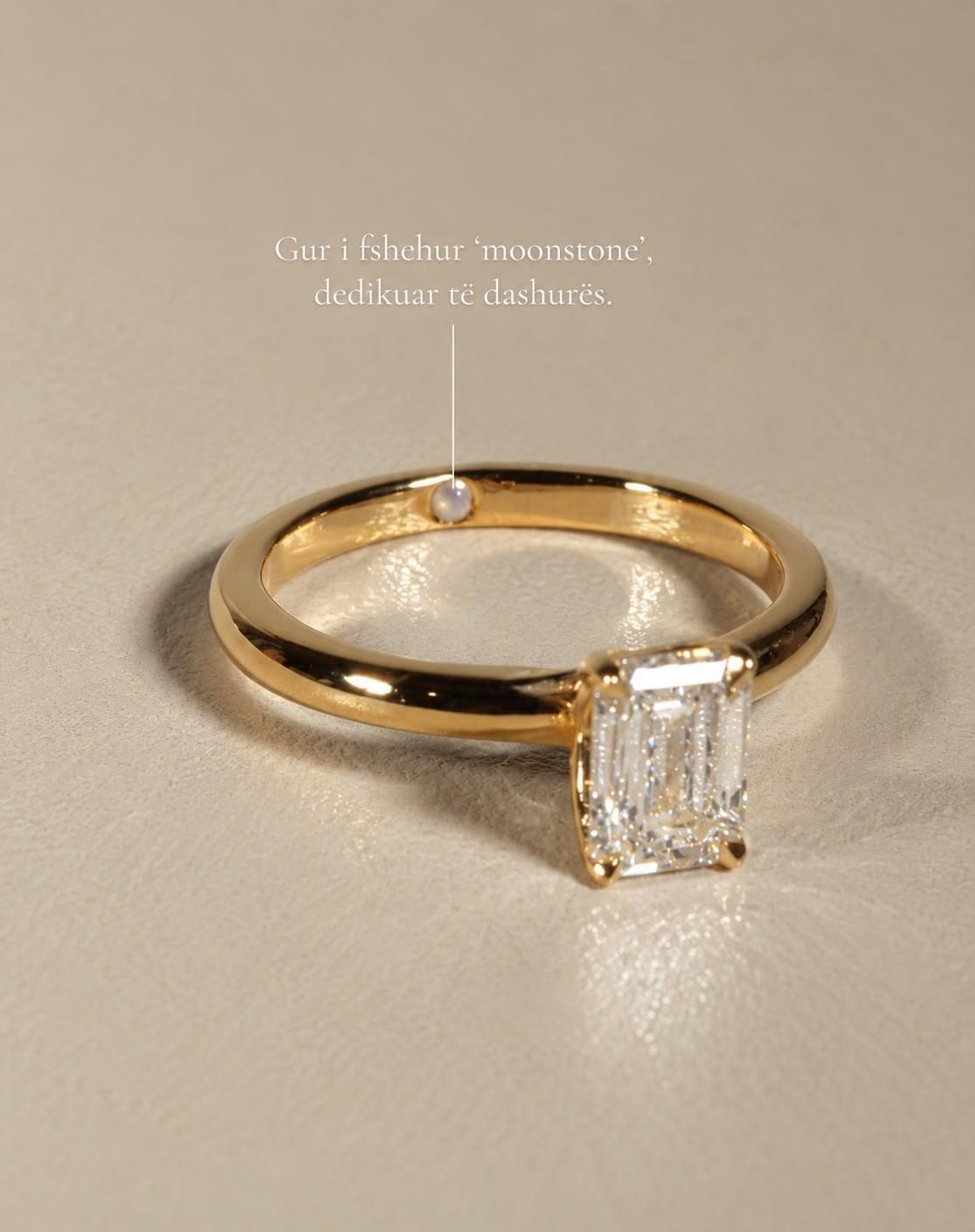 Emerald solitaire with a hidden moonstone set inside the band