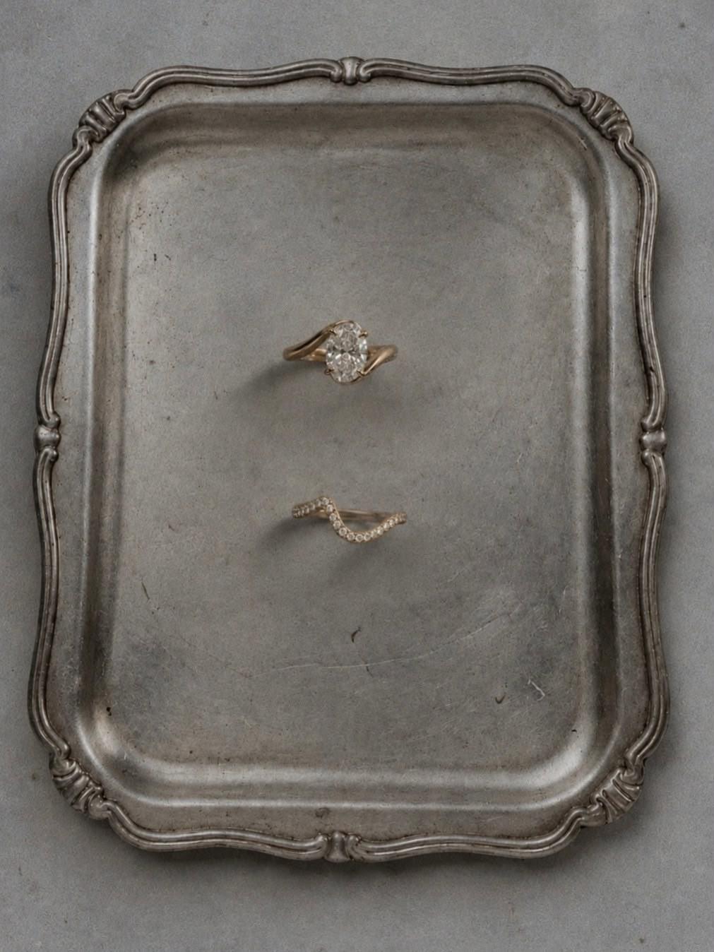 The Oval and its curved pavé band on an antique pewter tray