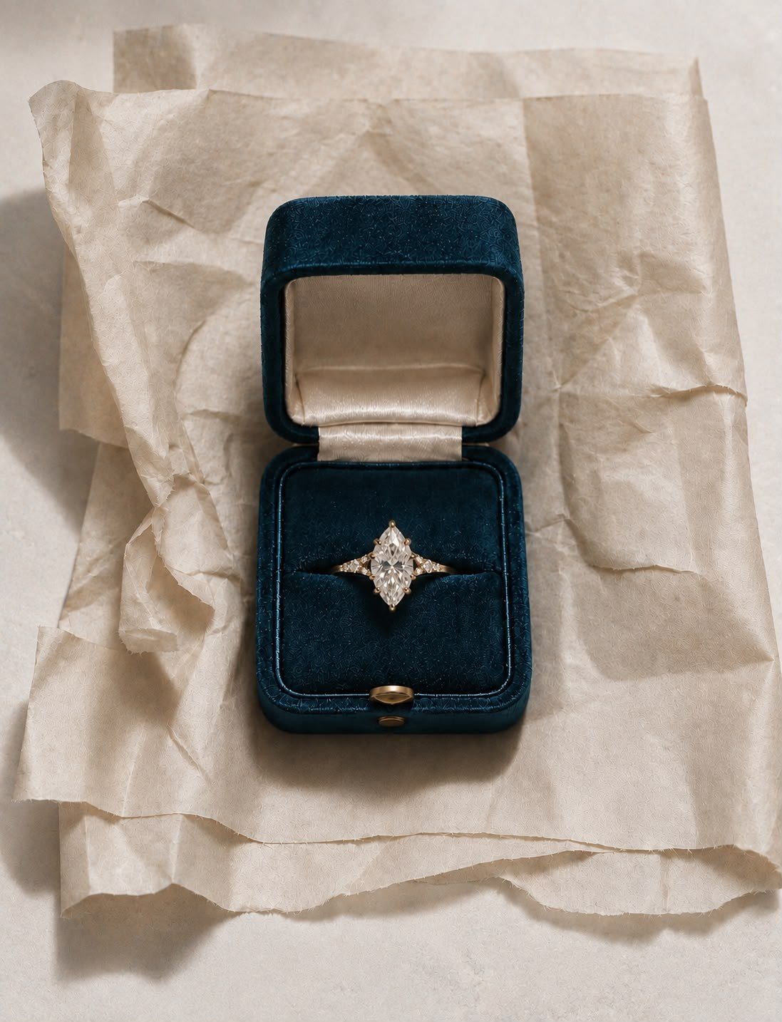FATBARDHA ring in an open petrol velvet FLORA box on crumpled tissue